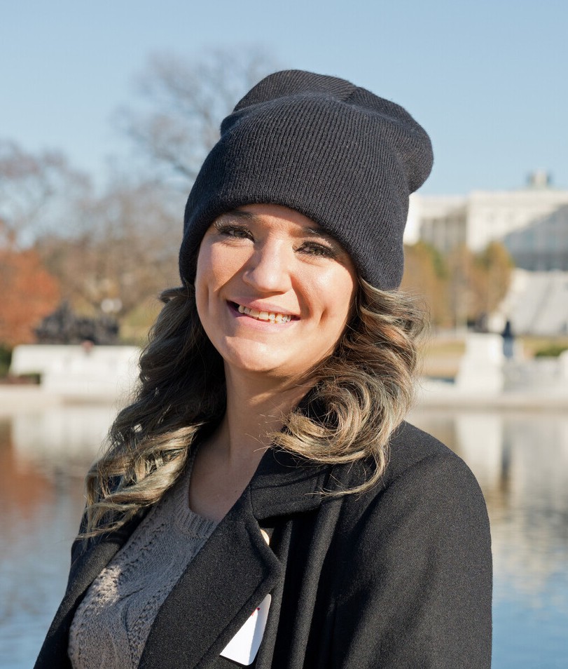 Headshot of JoaAnna Vance near White House