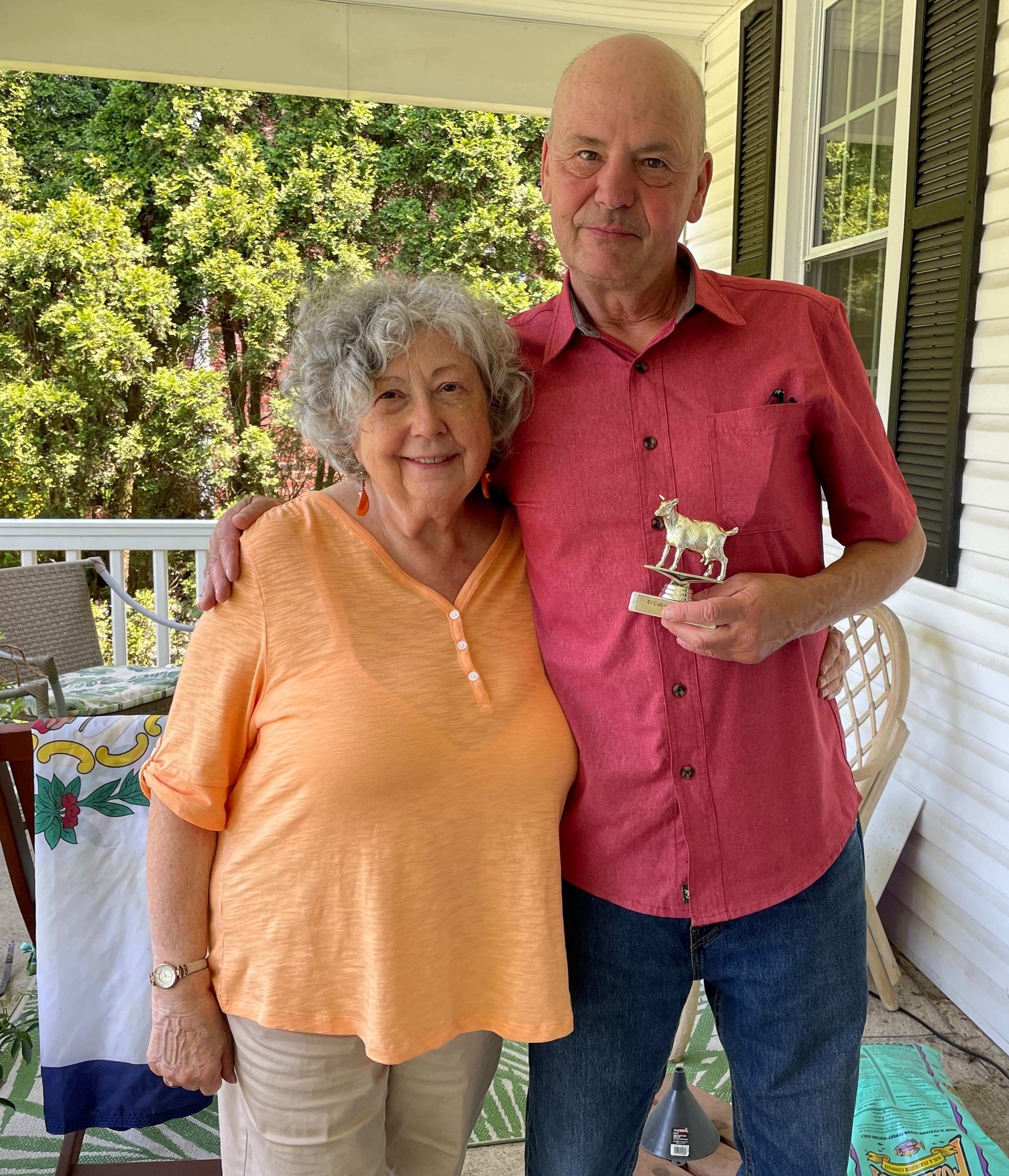 Picture of a man and a woman on a front porch