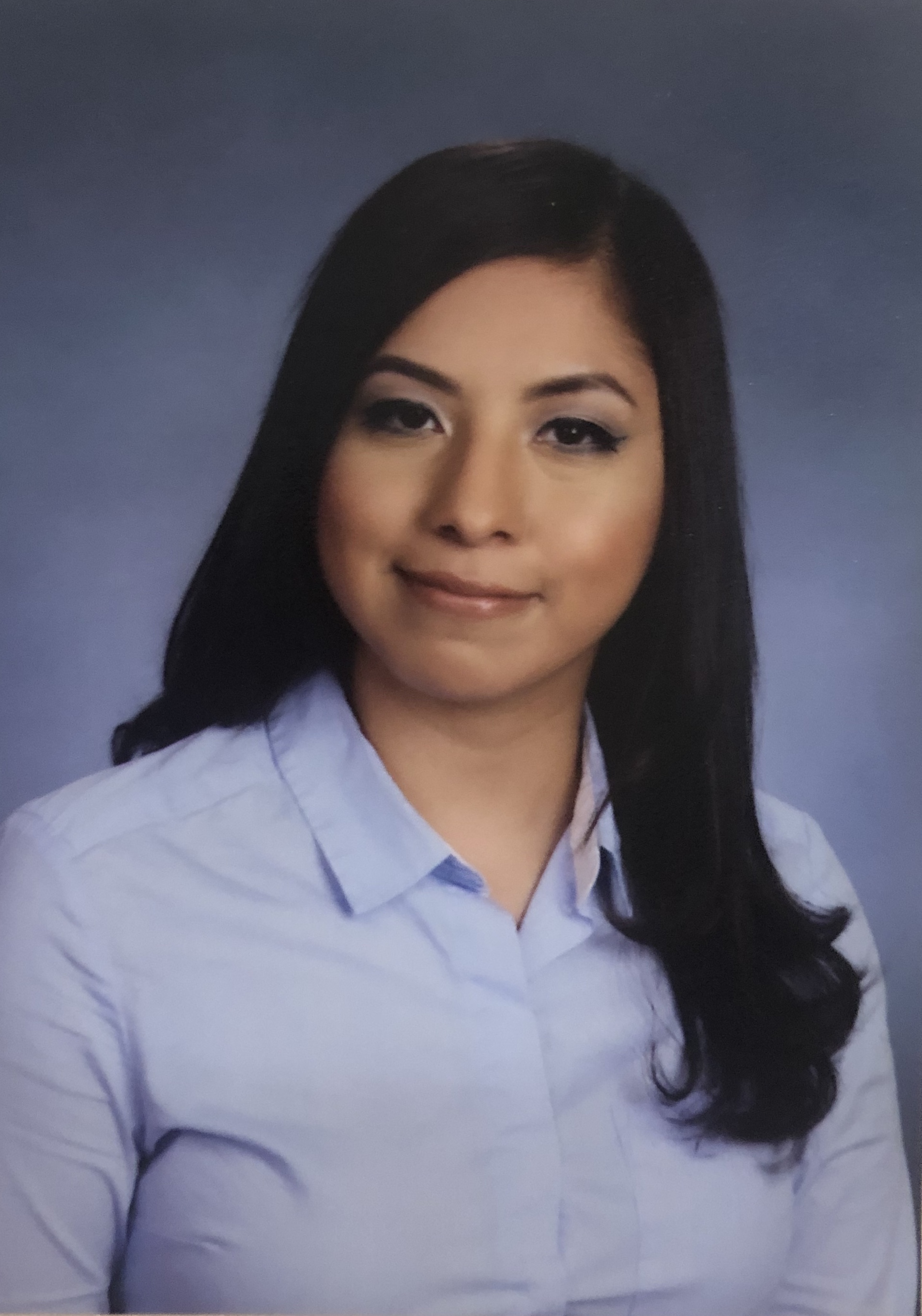 Professonal headshot of a woman in collared shirt