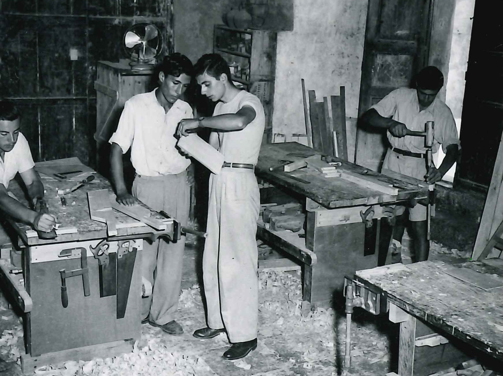 Two men working on a woodworking project.