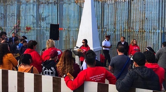 Community members taking part in the Posada on Tijuana, Mexico side of the border fence. Photo: AFSC Latin America and Caribbean region