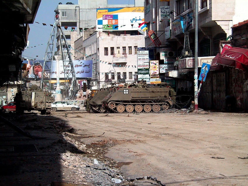 Tanks and armored personnel carriers gathered at Manara Square in the center of Ramallah during one of the liftings of the curfew. Photo by Peter Shafer.