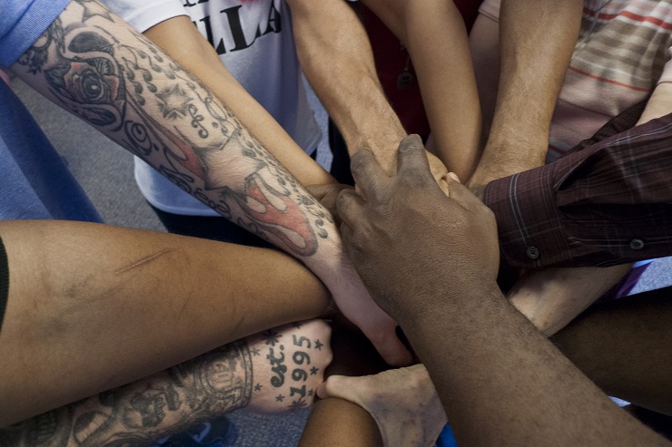 A "light and lively" game played during an Alternatives to Violence Project workshop conducted at the Claymont Community Center in Wilmington, Delaware. AVP was invented by Quakers to calm rioting at the Attica prison in 1975. Since then AVP has been exported to 119 countries. It is mostly run in prisons, but is also run in community groups, as here. By TCDavis via CC Flickr License 