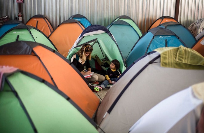 A family with an earlier migrant caravan that traveled to the U.S. in spring 2018. Photo: Omar Martínez